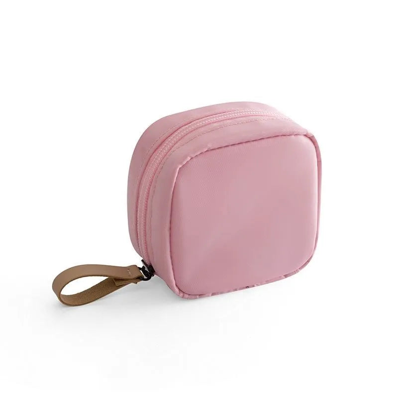 Blue cloth cube-shaped makeup storage bag with plain pattern