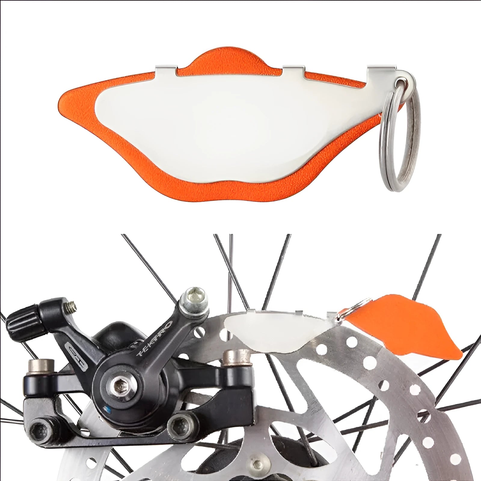 Mountain bike disc brake replacement linings in black and orange colours with adjustment flap