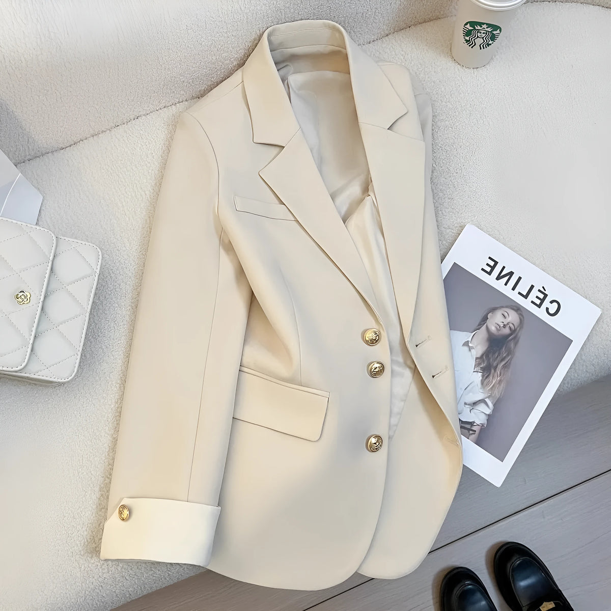 Women's loose-fitting mid-length polyester coat in milky white with pockets.