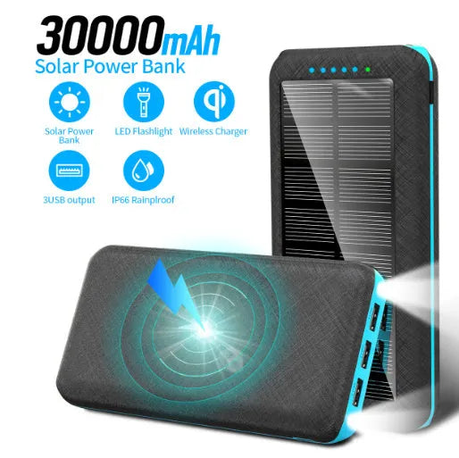 Black portable power bank with Qi wireless charging pad and three USB ports on the side