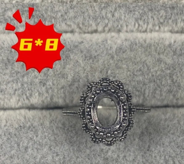 Oval denier ring with open mouth design, 6x8 main stone, and five-pointed star motif in electroplated copper