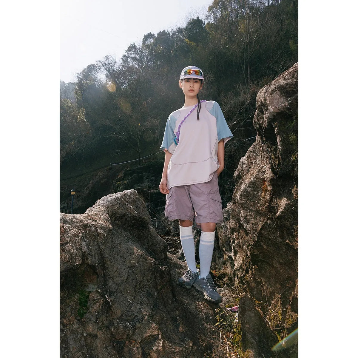Man wearing a loose-fit patchwork contrast colour short sleeve cotton blend sports t-shirt.
