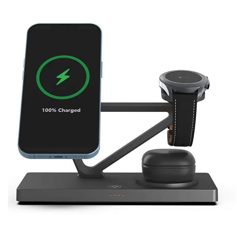 White five-in-one wireless charging station with magnetic phone bracket, circular charger, watch pad, and night lamp on desk.