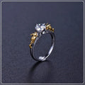 Copper crown crystal ring in black gold colour on a neutral background.