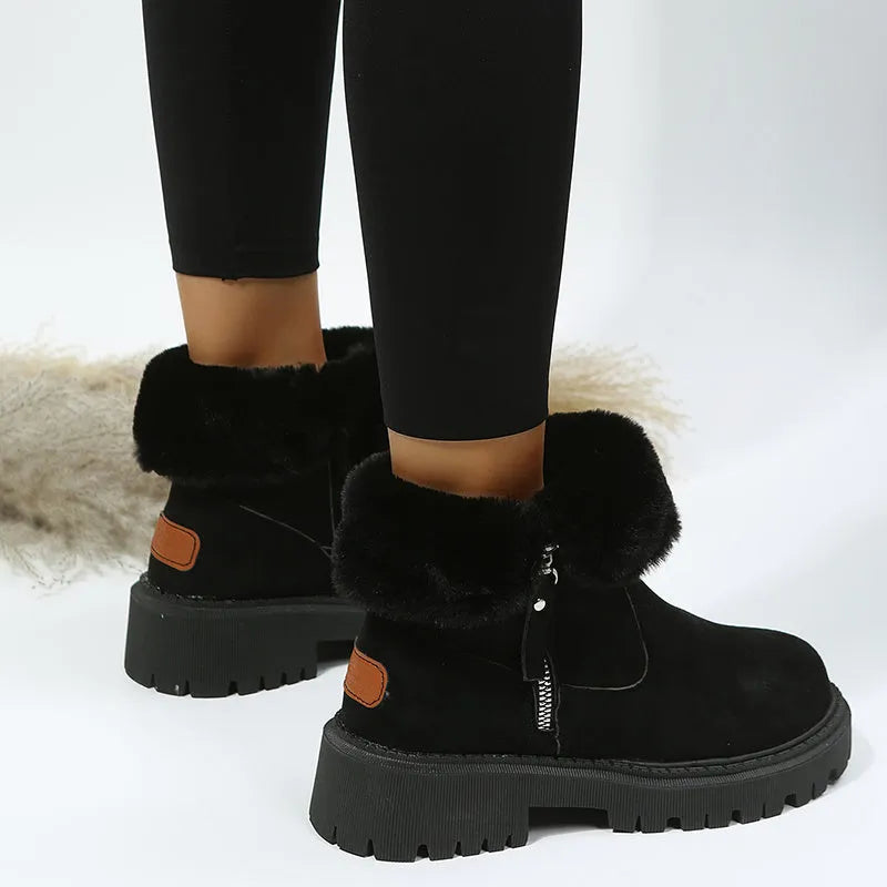 Women's black faux suede snow boots with thick plush lining and side zip closure