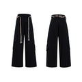 Men's dark blue loose fit straight-leg jeans with decorative belt stitching and zipper details.