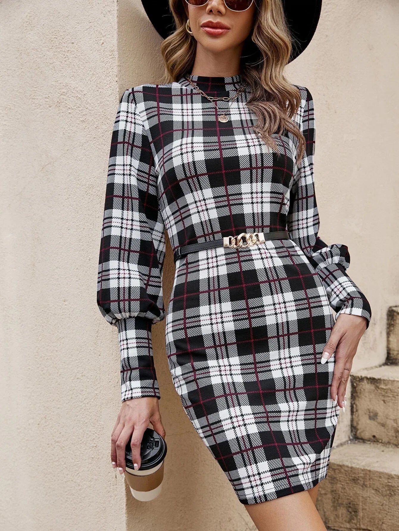 Black women's tight dress with lantern sleeves and leather stitching details
