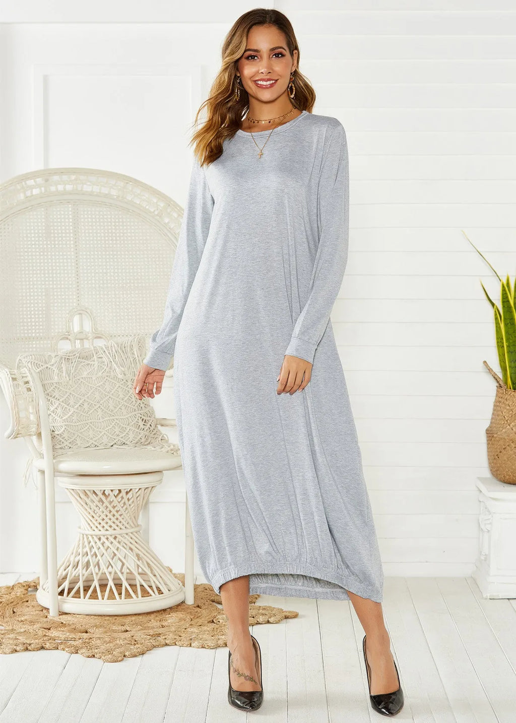 Loose long black lantern dress with a lace-up crew neck, showcasing a casual pullover style.
