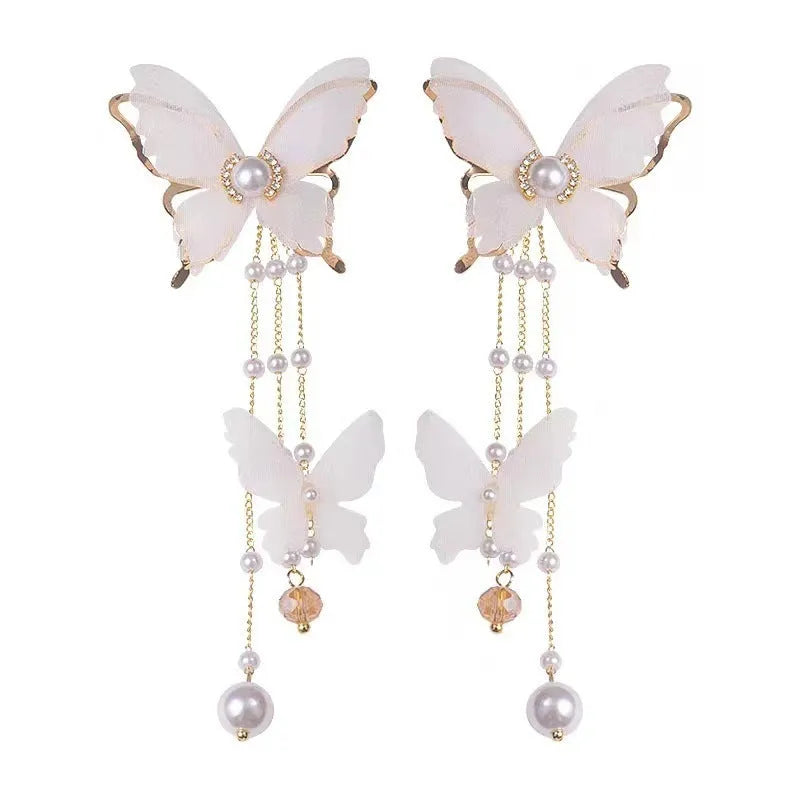 White butterfly earrings with tassel lace, pearl and rhinestone decoration on copper alloy