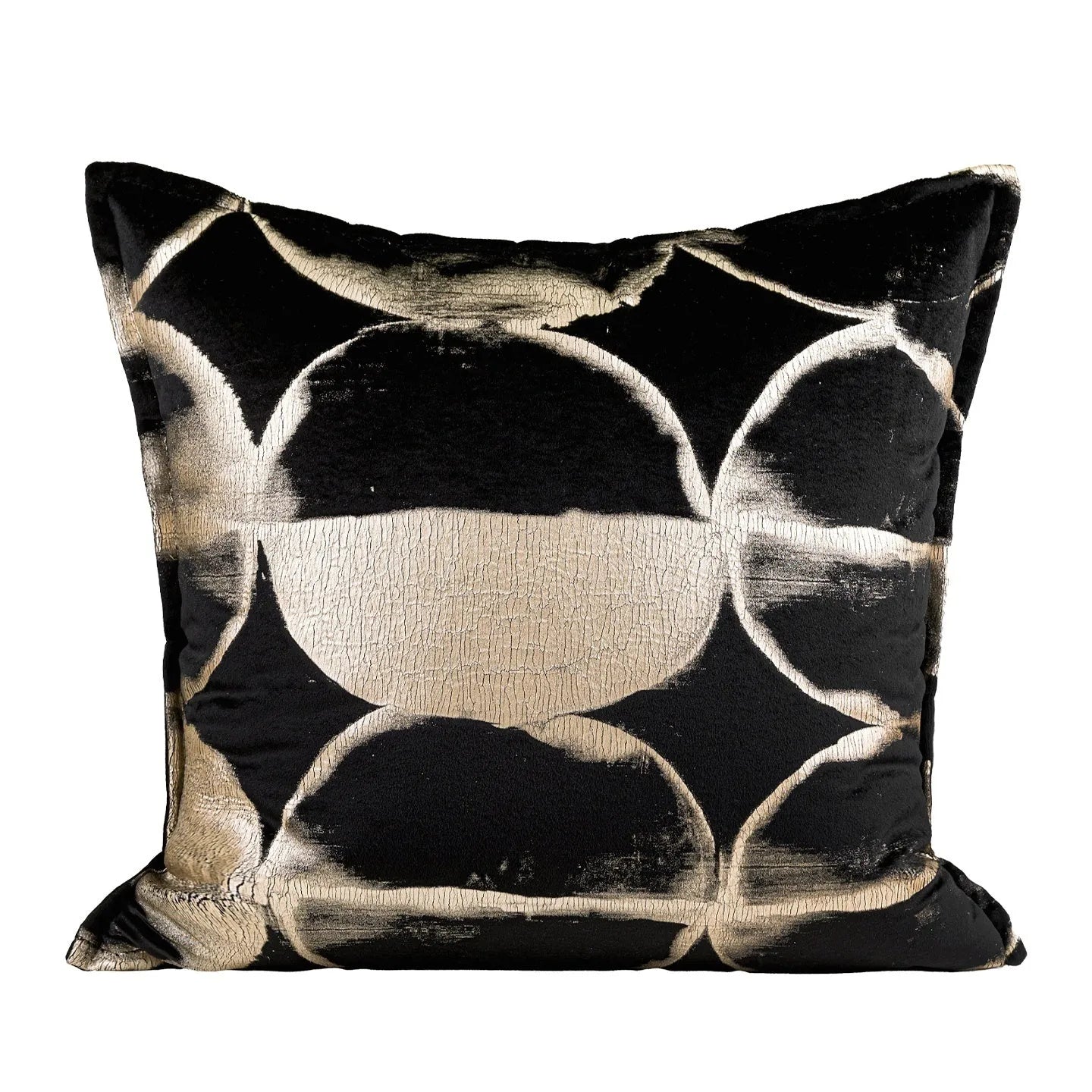 Black and gold abstract patterned square cushion on a grey sofa