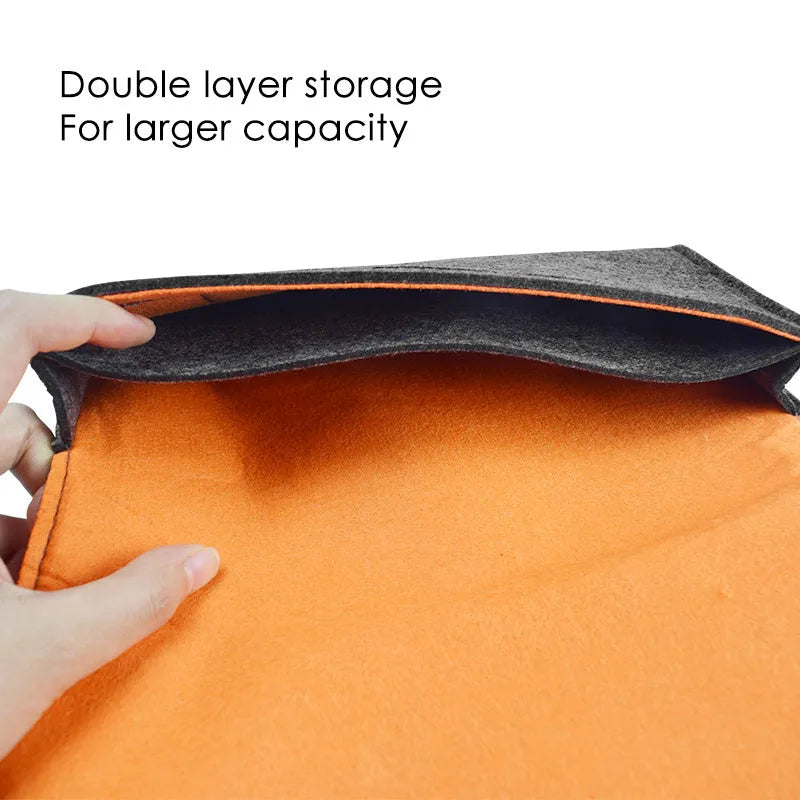 Black felt pouch for Nintendo Switch console with a carrying handle and game card slots