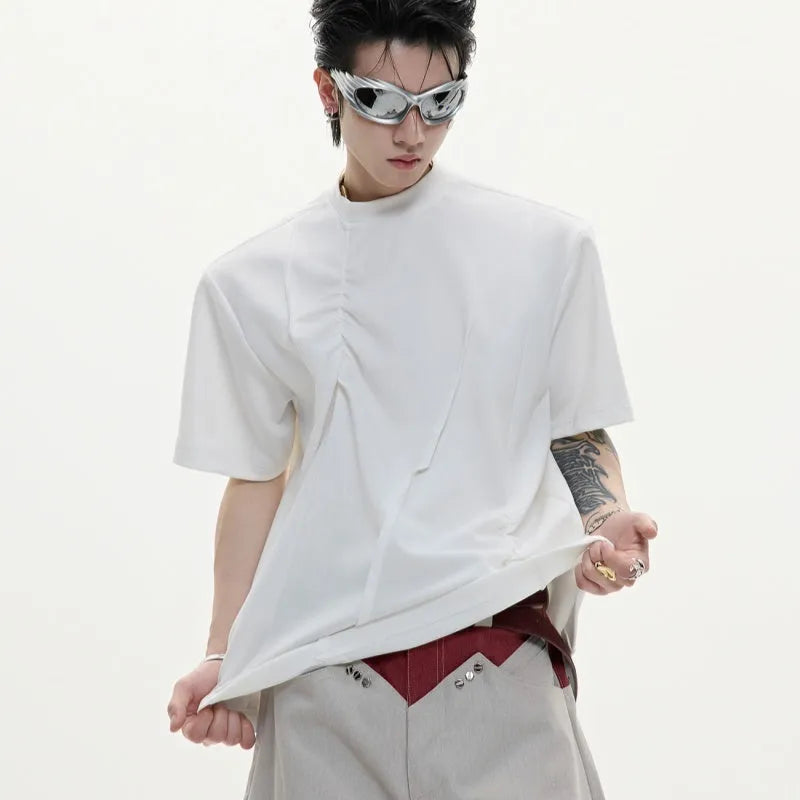 Men's loose grey cotton T-shirt with three-dimensional pleating detail on the front.
