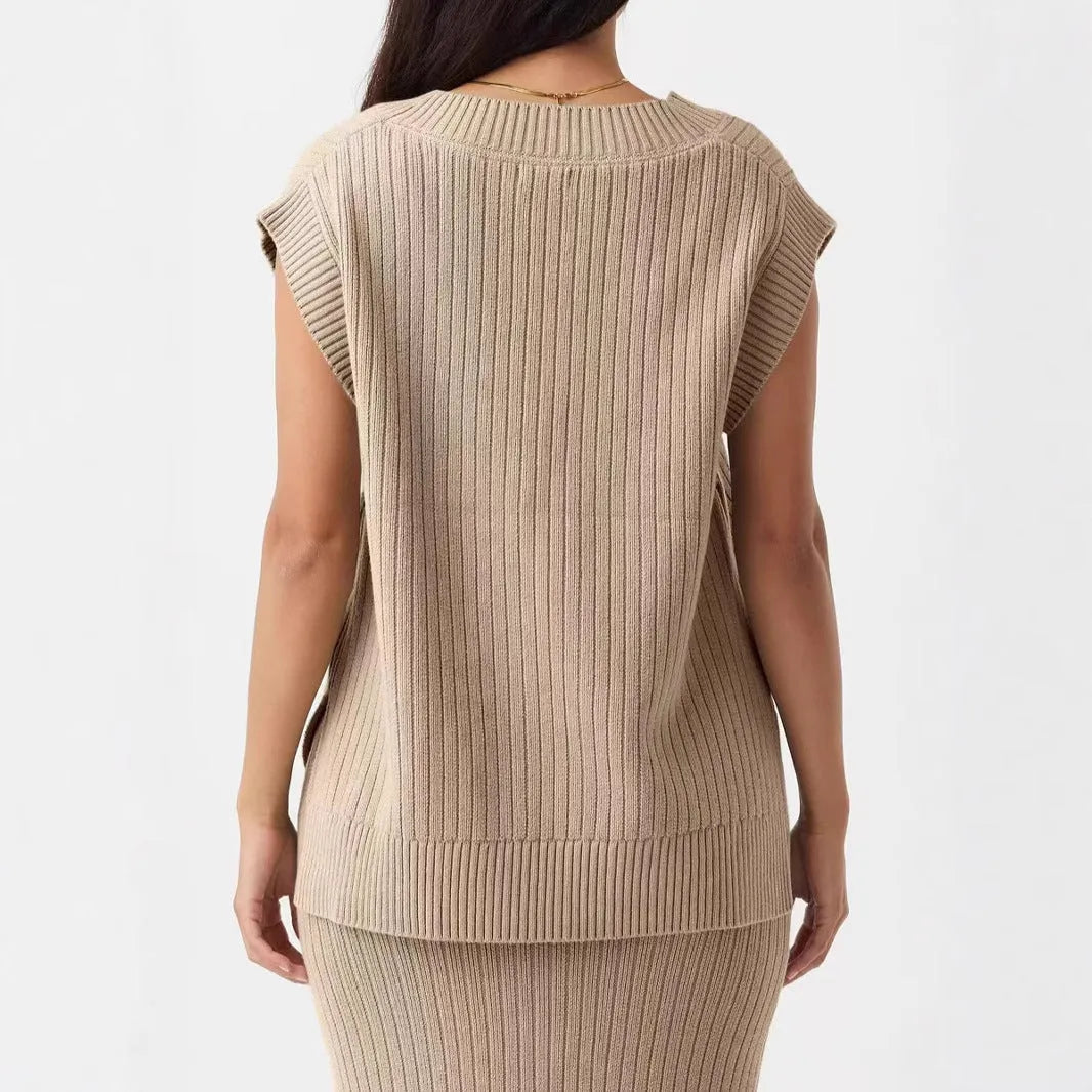 A woman's camel-coloured loose V-neck sleeveless vest with a thin striped pattern, laid flat.