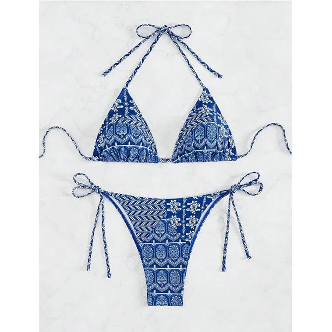 Women's green split bikini bandage swimsuit with printed stitching on a model