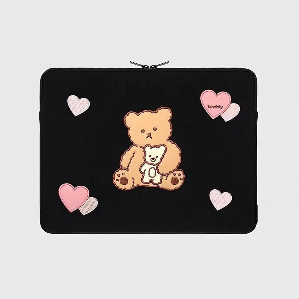 Embroidered laptop sleeve with animal design showing polyester construction and laptop size compatibility