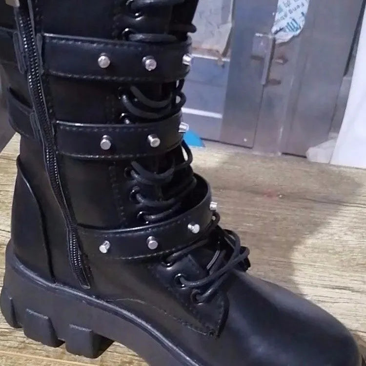 Black women's mid-calf knight boots with metal buckle and side zipper on a round toe.