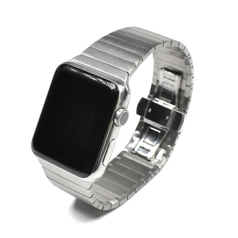 Silver metal Apple Watch band with butterfly clasp on a 40mm watch case.