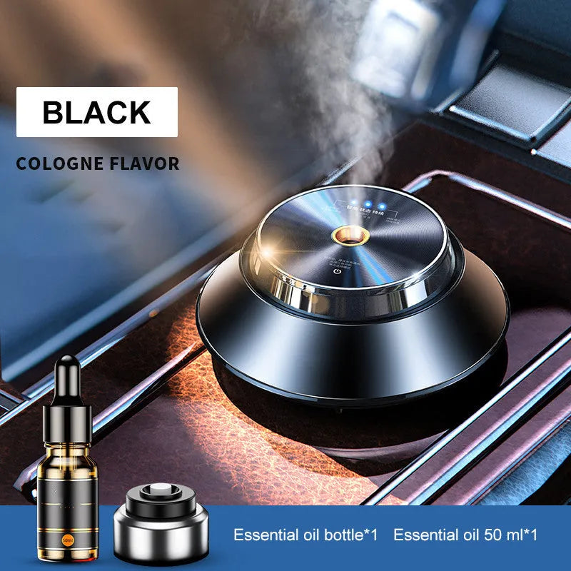 Black metal butterfly design car aromatherapy air purifier with USB cable and essential oil bottle.