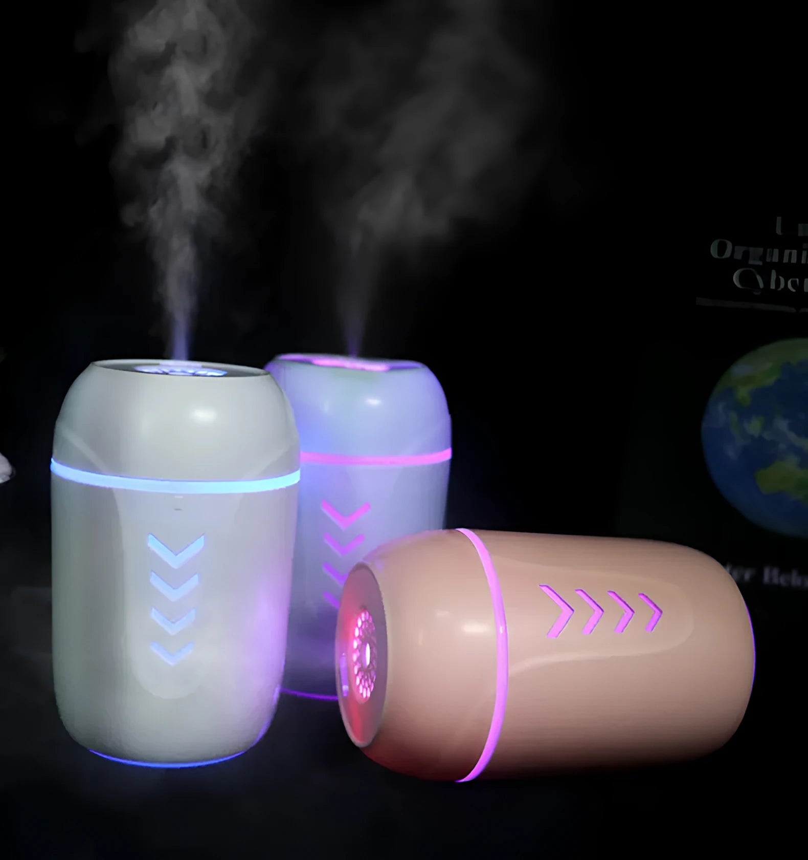 Blue X3 portable columnar humidifier with USB cable on a car dashboard.