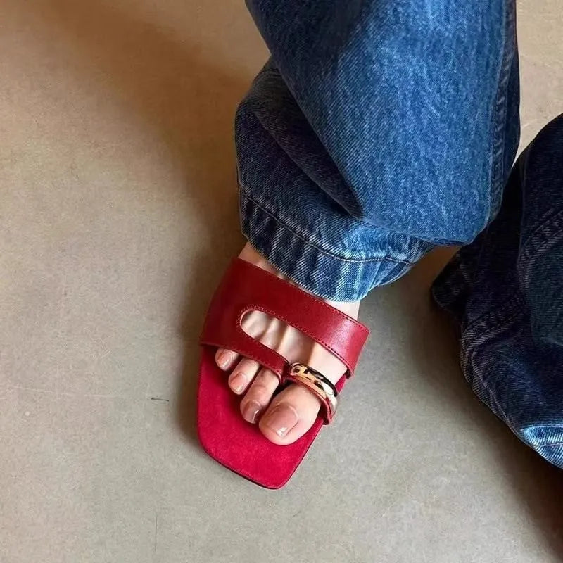 Square toe leather outdoor slipper in multiple colours on a plain background.