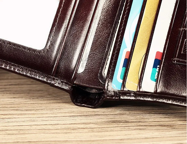 Men's black and coffee brown leather wallet open to show multiple internal card slots, note pocket, and coin compartment.