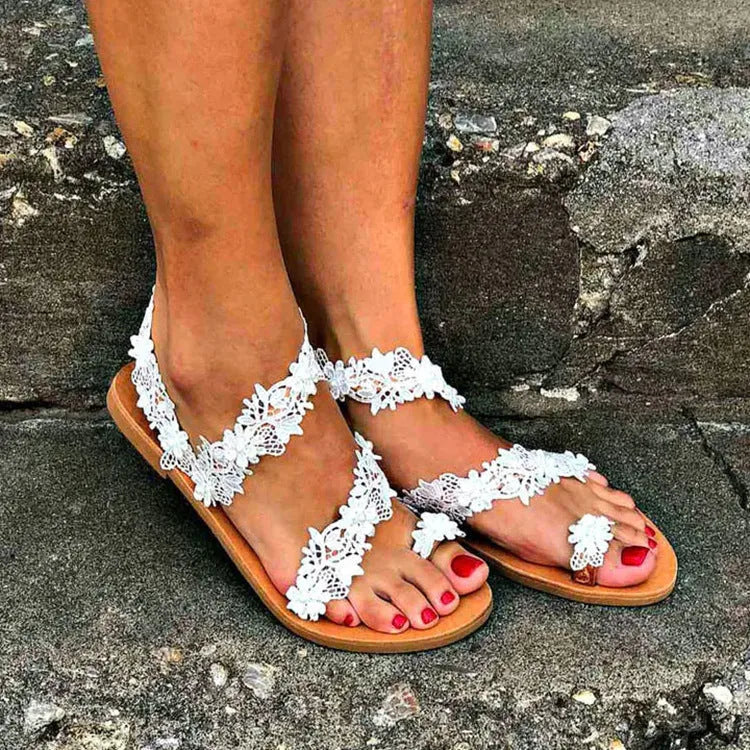 White women's sandals with floral rhinestone decoration and round toe design