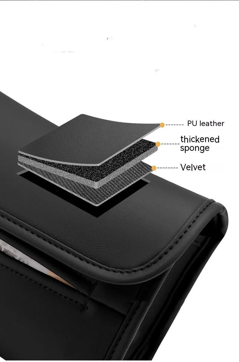 Leather car tissue holder box with elastic strap for mounting on seat back.