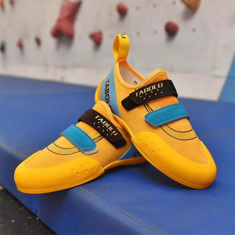 Beginner unisex rock climbing shoes with Velcro strap in black and red colour option.