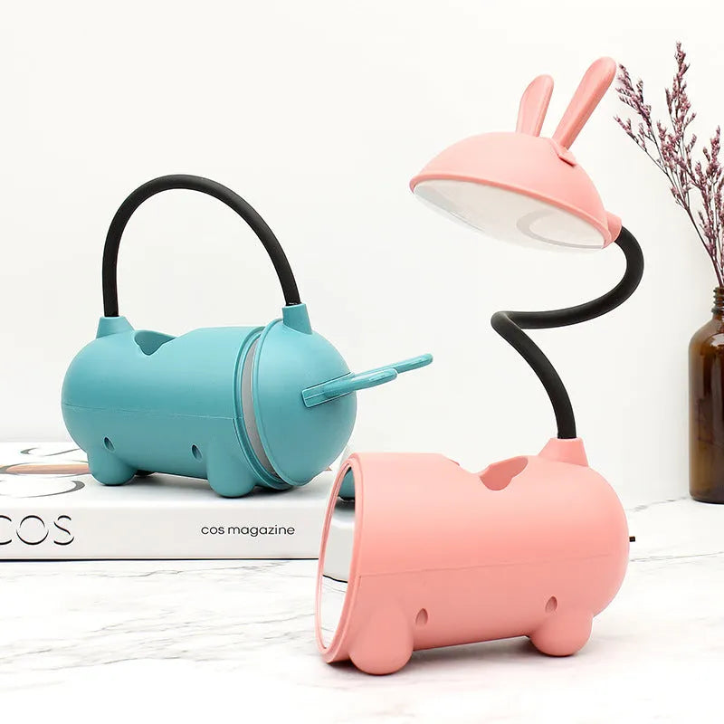 Cartoon-style USB desk lamp with pen container in dark blue, green or pink colours