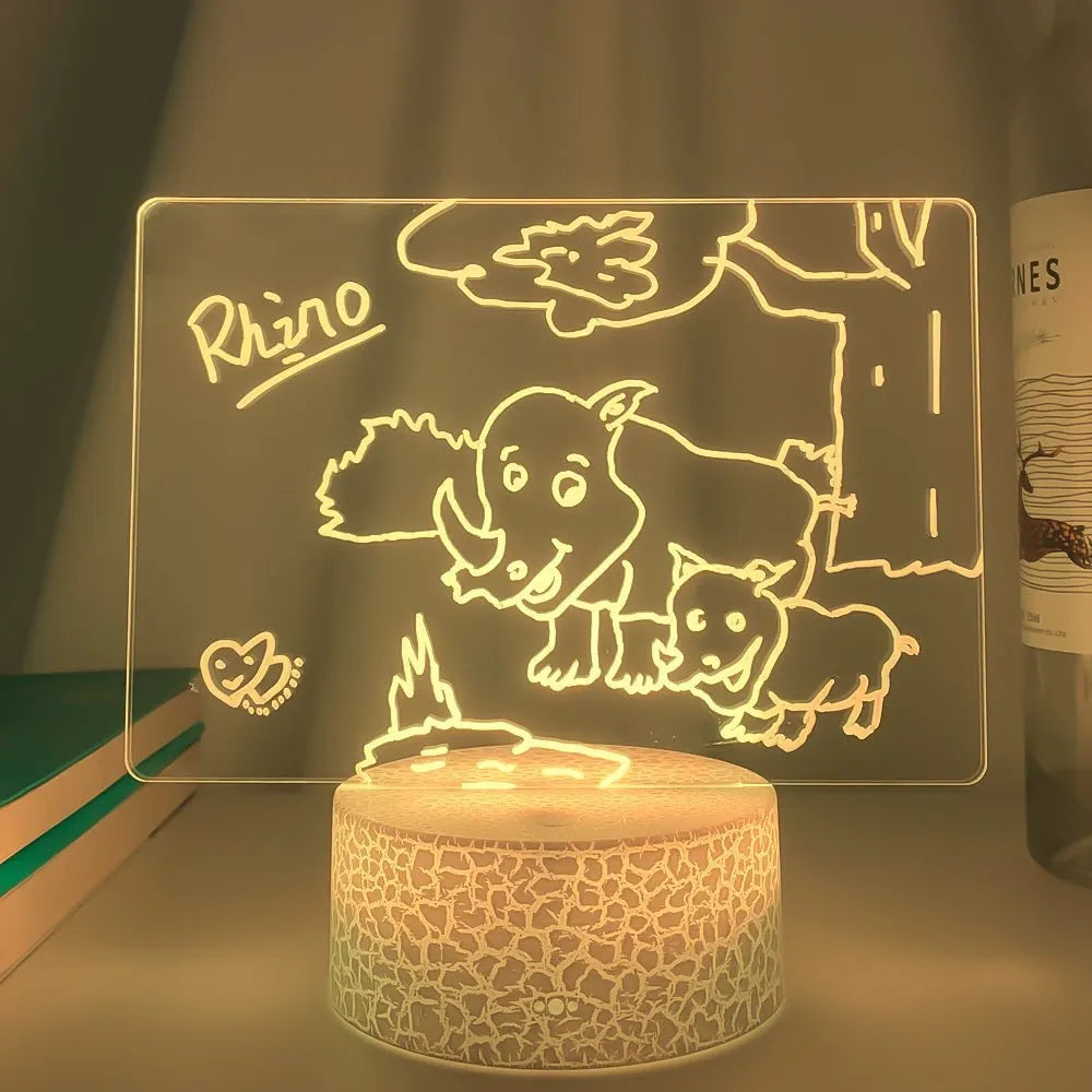 3D handwritten acrylic message board night light with black base and remote control displaying glowing text