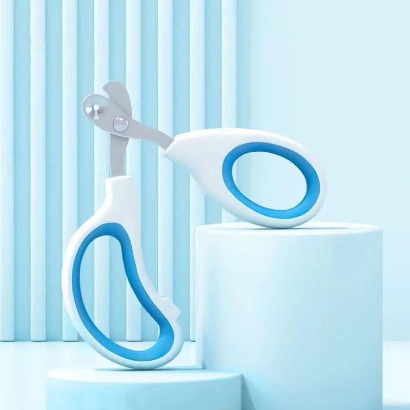 Blue pet nail clippers with a circular safety hole and cushioned non-slip handle.