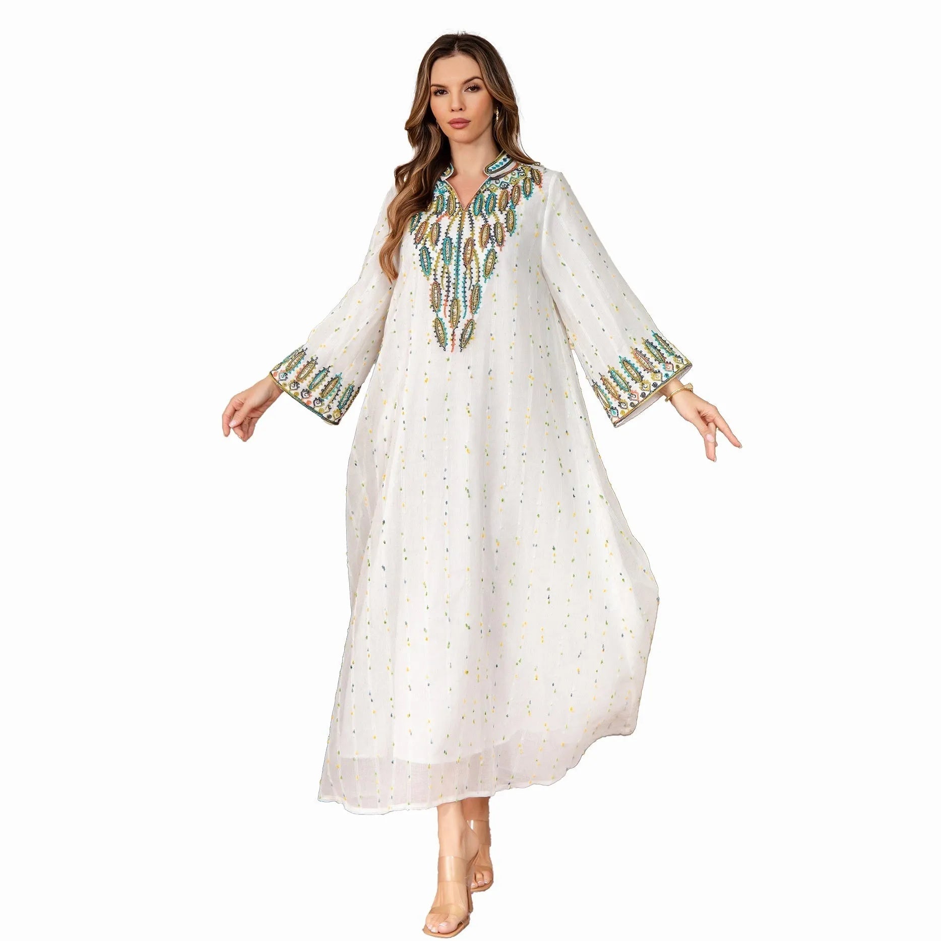 White women's Dubai Arabic robe with long sleeves and floor-length skirt.