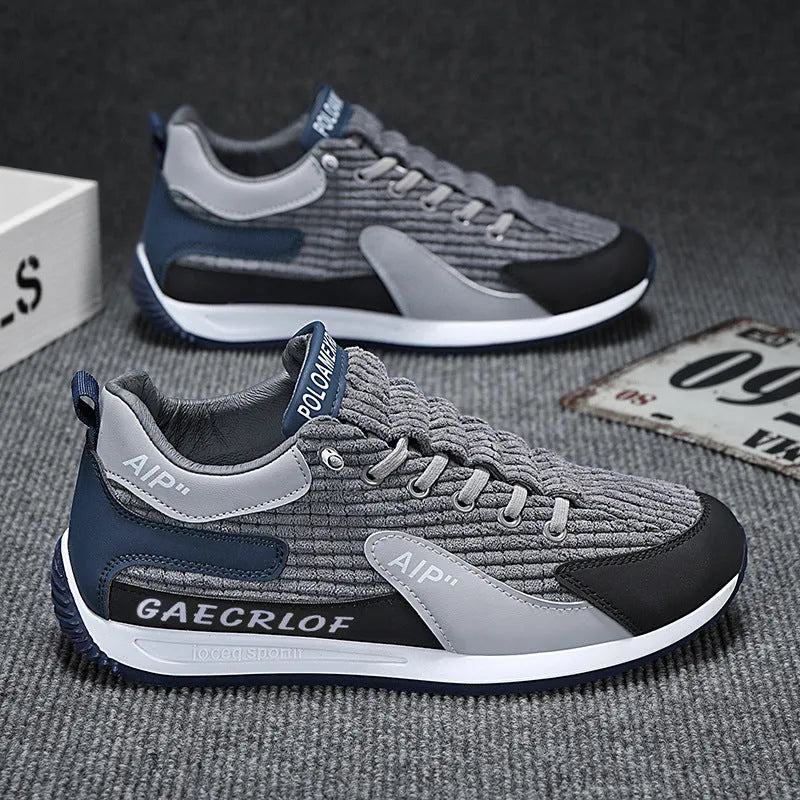 Men's grey and green mesh running shoes with low-top design and lace-up closure