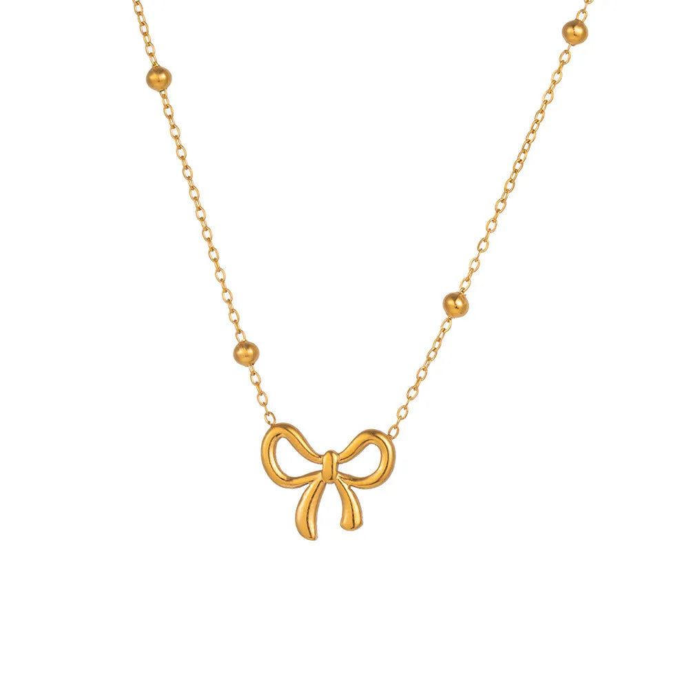 Gold-colour titanium steel necklace with a bow pendant on an adjustable chain