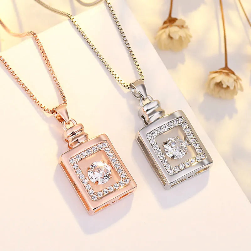 Sterling silver heart pendant necklace with crown and bow detail in rose gold or silver colour options