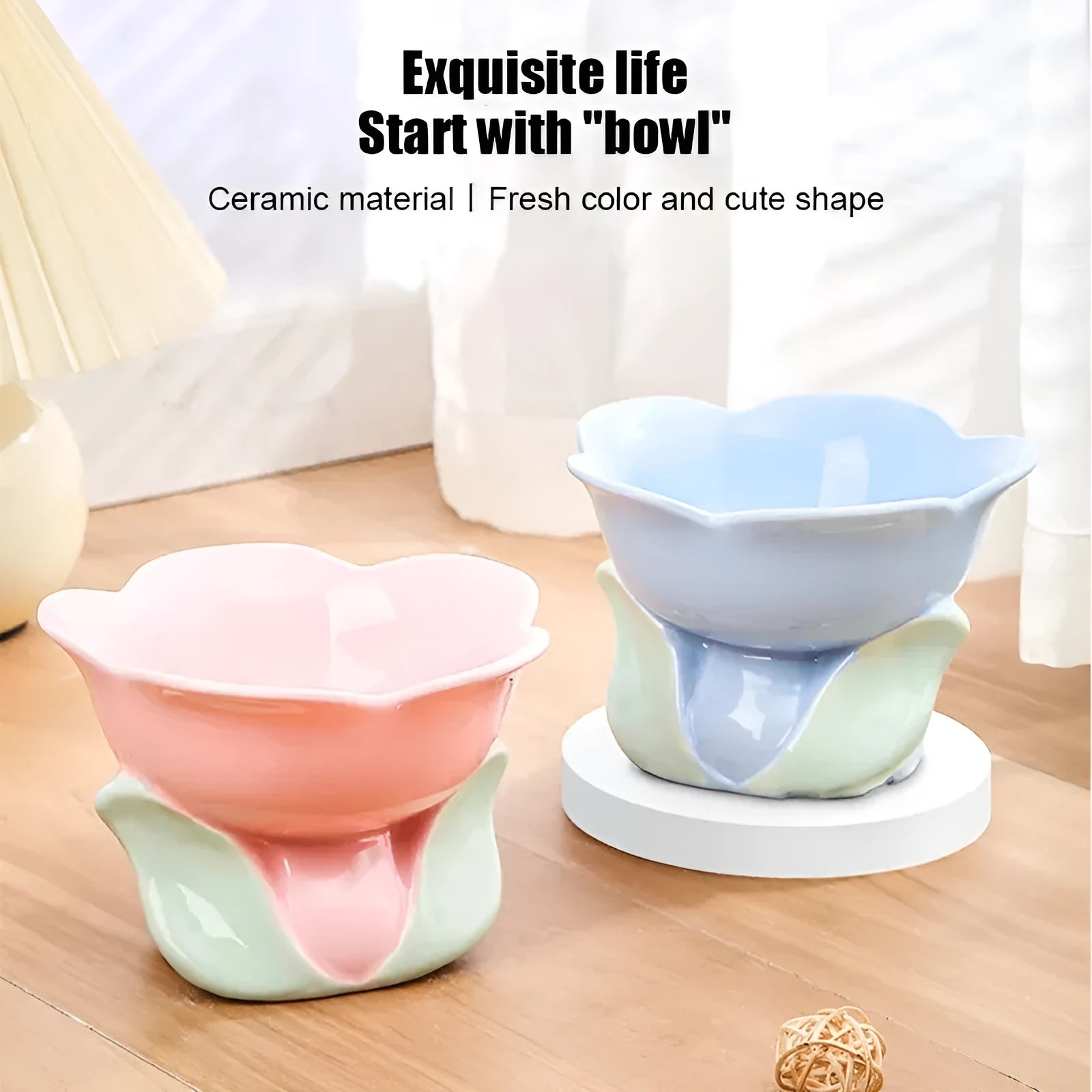 Blue ceramic raised pet bowl with floral pattern and non-slip base for cat or small dog.