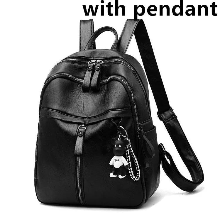 Black medium-size PU leather soft surface backpack with double straps and a zipper opening