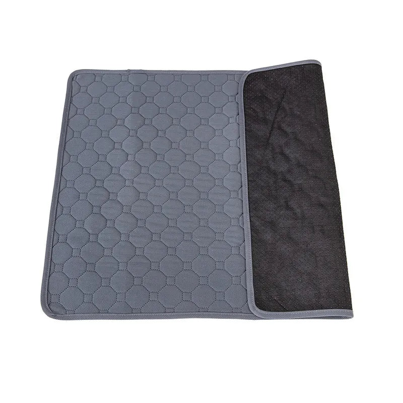 Washable tan and grey reusable dog pee pad on a wooden floor