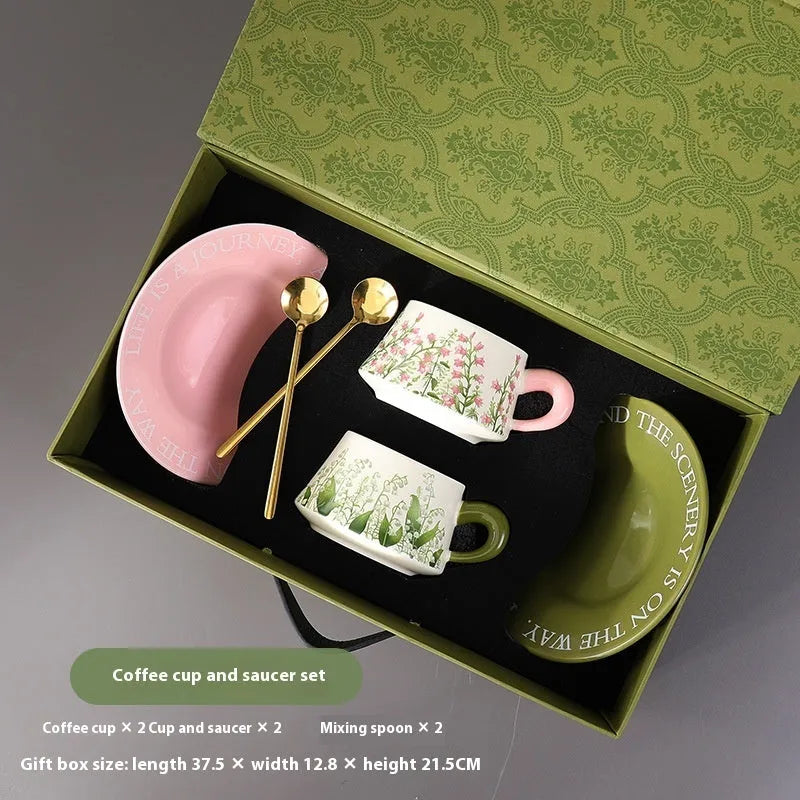 Ceramic coffee cup and saucer set with two cups, two saucers and two stirring spoons