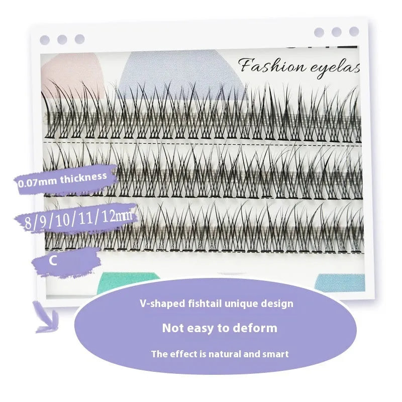 Black V-shaped fairy fishtail false eyelashes with thick segments in varying lengths on a clear tray.