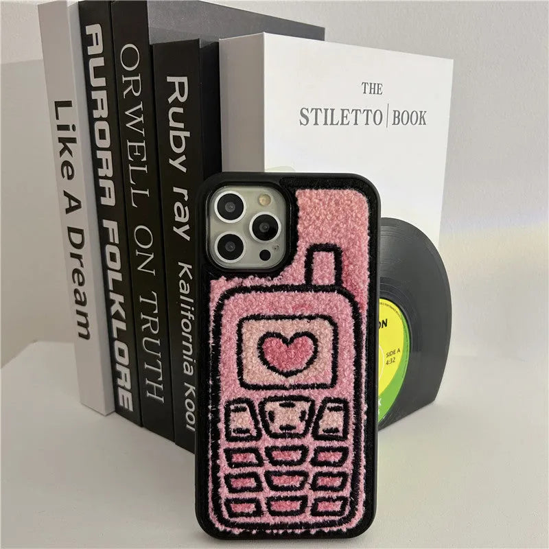 Pink TPU iPhone case with a raised towel embroidery texture on the back.