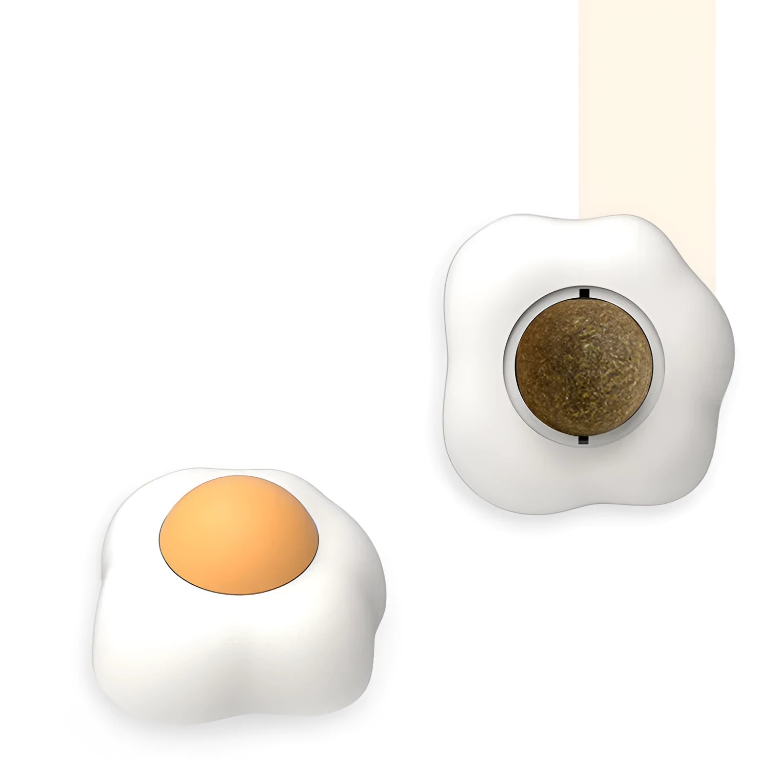 Interactive catnip ball toy with adhesive backing for walls, available in fried egg and poached egg designs