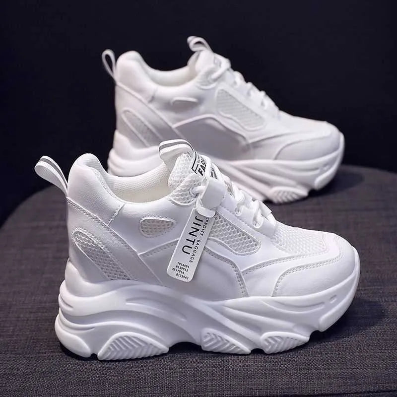 Women's black mesh platform casual slip-on shoes with a hollow-out toe holder design on a white background.
