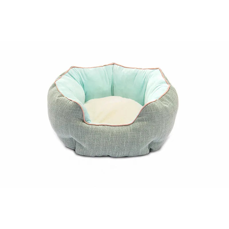 Blue octagonal pet bed with soft wool point design and removable mat for a small dog.