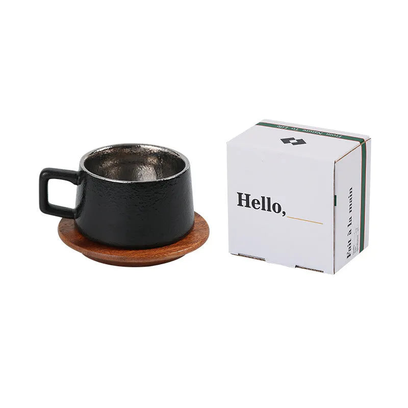 Gold and silver plated gift box next to a 250ml solid colour coffee travel mug.