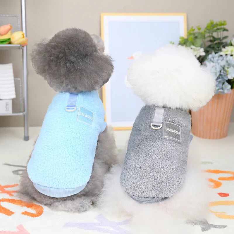 A blue coral fleece pet jacket for dogs or cats fastened with multicoloured pull rings.