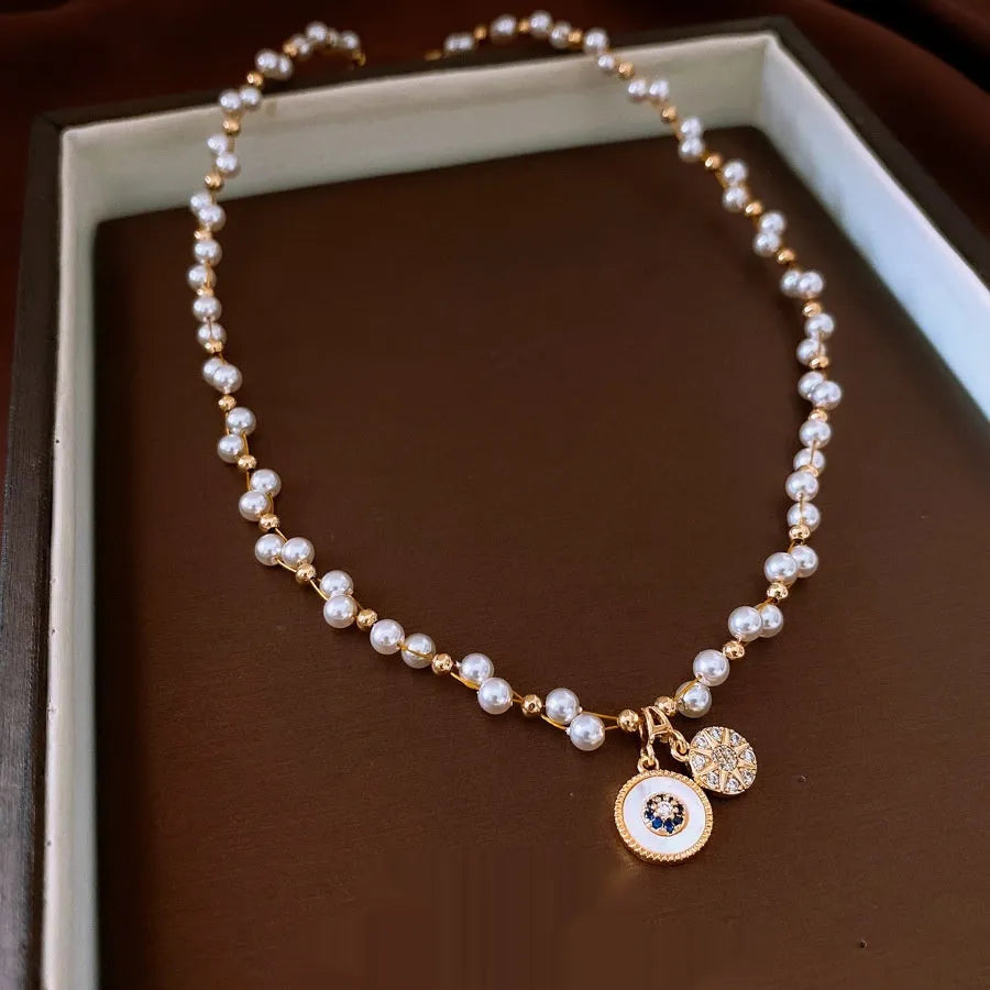 Gold electroplated zircon pearl pendant necklace on adjustable clavicle chain