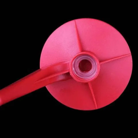Red Magic Tap soda dispenser attached to inverted 2-litre bottle