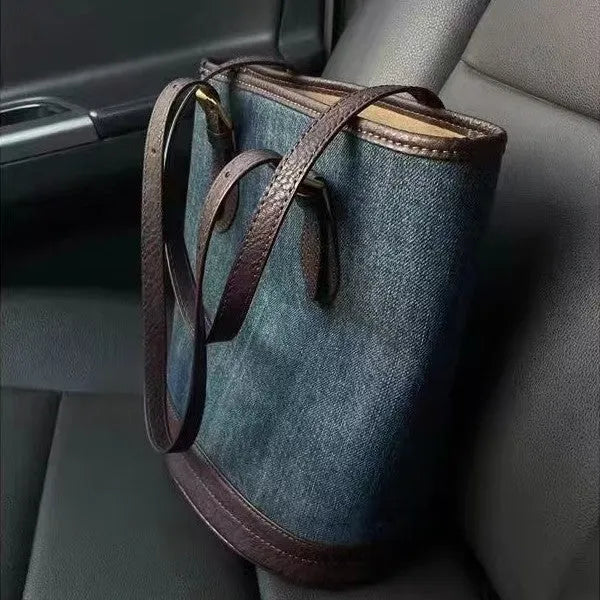 Denim patchwork handbag with one-shoulder bucket design showing dimensions