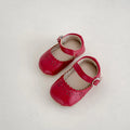 Solid colour hollow breathable soft sole shoes with rubber sole and artificial PU upper, shown in red.